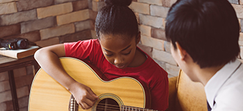 Little Girl playing Guitar