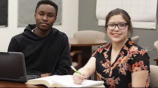 Male and Female sitting in classroom