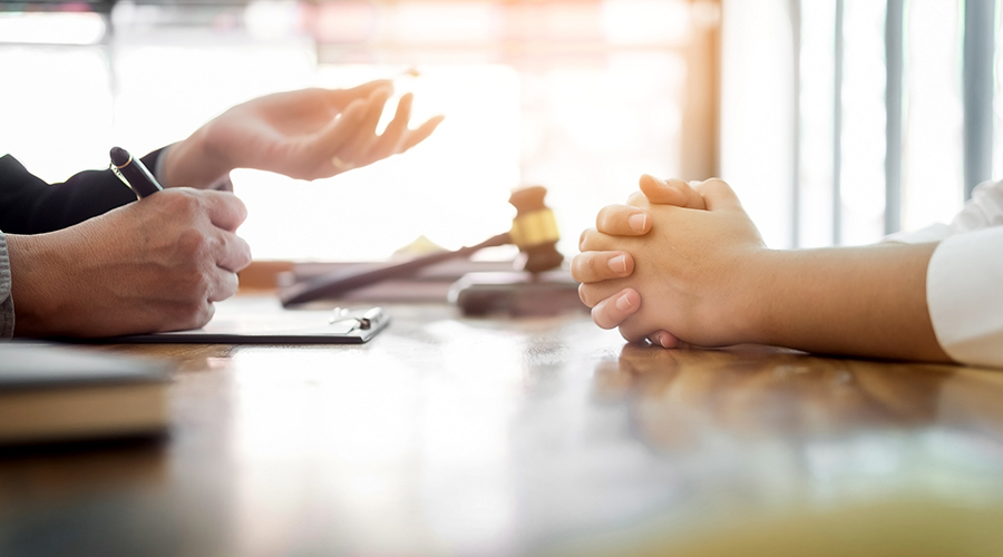 Hands on table with gavel