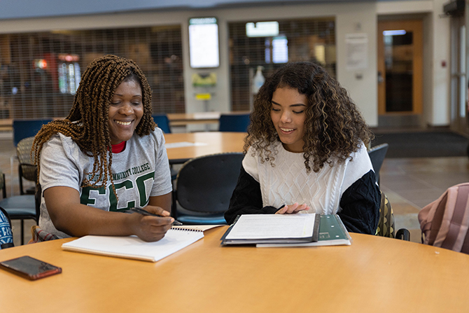 2 students at table