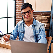 Male behind laptop