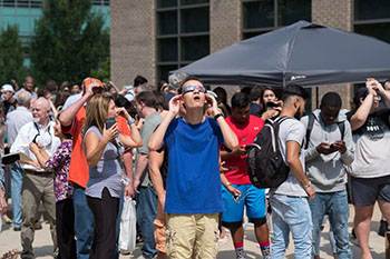 Students looking at Solar Eclipse