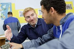 Men sitting at table talking
