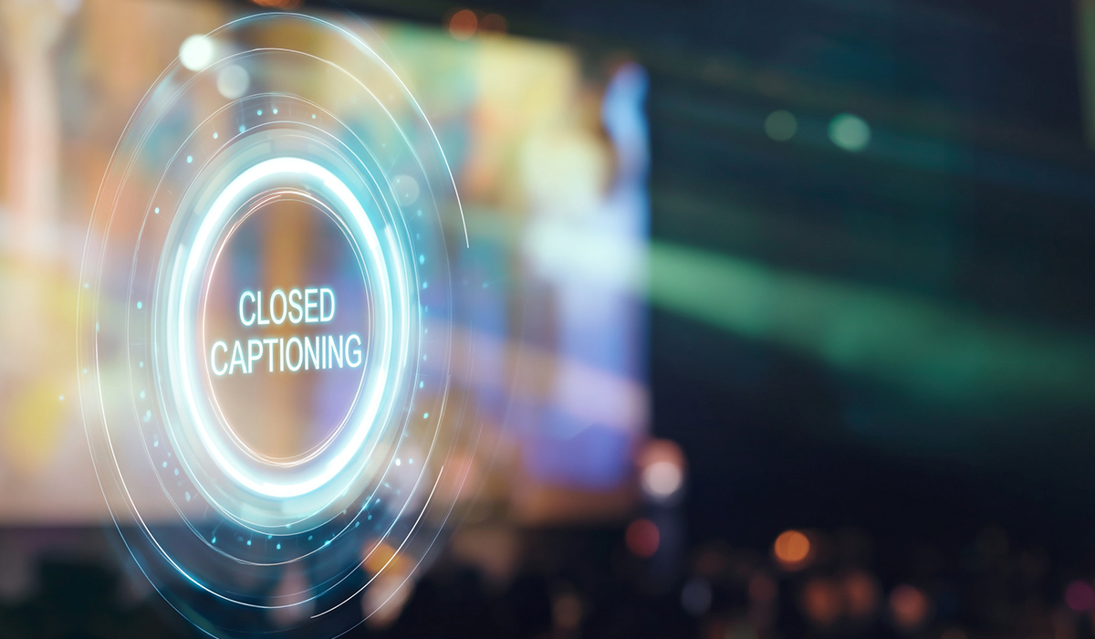 A glowing digital graphic featuring the words "CLOSED CAPTIONING" inside glowing neon circles against a blurred event background.